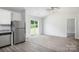 Open-concept living space featuring carpet, sliding glass door and stainless appliances in the kitchen area at 1538 Doran Ter, Richburg, SC 29729