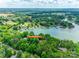 Aerial view of lakefront property featuring lush trees, boat docks, and waterfront access at 16317 Terry Ln, Huntersville, NC 28078