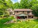 Aerial view of the backyard showcasing a well-maintained lawn, patio and lush landscaping at 16317 Terry Ln, Huntersville, NC 28078