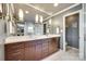 Modern bathroom featuring dual sinks, a spacious walk-in shower with glass doors, and clean white finishes at 16317 Terry Ln, Huntersville, NC 28078
