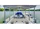 Covered boat dock featuring a boat and jet ski, offering convenient access to the lake at 16317 Terry Ln, Huntersville, NC 28078