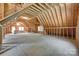 Unfinished bonus room featuring exposed wood beams, light-filled windows and open space at 16317 Terry Ln, Huntersville, NC 28078