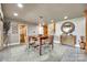 Spacious dining area features a wooden table, stylish seating, and a decorative mirror at 16317 Terry Ln, Huntersville, NC 28078