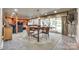 Inviting dining area with bar height table, chairs, and natural light that creates a pleasant dining atmosphere at 16317 Terry Ln, Huntersville, NC 28078