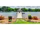 Beautiful dock featuring a covered gazebo, elegant lighting, and colorful flower arrangements enhancing the waterfront view at 16317 Terry Ln, Huntersville, NC 28078
