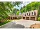 Charming brick home with a spacious driveway, three-car garage and well-manicured landscaping at 16317 Terry Ln, Huntersville, NC 28078