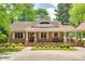 Charming brick home with a welcoming front porch, manicured landscaping, and a stone walkway at 16317 Terry Ln, Huntersville, NC 28078