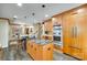 Modern kitchen featuring custom cabinetry, granite countertops, stainless steel appliances, and a breakfast bar at 16317 Terry Ln, Huntersville, NC 28078