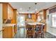 Modern kitchen featuring custom cabinetry, granite countertops, stainless steel appliances, and a breakfast bar at 16317 Terry Ln, Huntersville, NC 28078