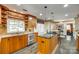 Modern kitchen featuring custom cabinetry, granite countertops, stainless steel appliances, and a breakfast bar at 16317 Terry Ln, Huntersville, NC 28078