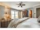 Bright main bedroom suite boasts natural light with a private balcony and comfortable seating at 16317 Terry Ln, Huntersville, NC 28078