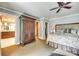 A view into the main bedroom featuring a large armoire and doorways to the closet and bathroom at 16317 Terry Ln, Huntersville, NC 28078
