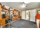 Open office space boasting custom built-in shelving, cabinets, and drawers with neutral-toned walls at 16317 Terry Ln, Huntersville, NC 28078