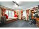 Bright office featuring a built-in desk, shelves, daybed near a window, and neutral walls at 16317 Terry Ln, Huntersville, NC 28078