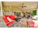 Covered patio with a stone fireplace, outdoor furniture, and a ceiling fan at 16317 Terry Ln, Huntersville, NC 28078