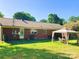 A spacious backyard features a gazebo and a well-maintained lawn at 1750 Sells Rd, Salisbury, NC 28144