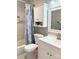 Bright bathroom with tub and shower, seashell-themed curtain, and a white vanity with cabinet at 1750 Sells Rd, Salisbury, NC 28144