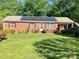 This lovely brick home features solar panels and a covered carport at 1750 Sells Rd, Salisbury, NC 28144