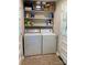 Convenient laundry area with washer and dryer hookups and storage shelves at 1750 Sells Rd, Salisbury, NC 28144