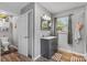 Clean bathroom featuring modern fixtures, vanity, and vinyl flooring at 1792 Hoffman Rd, Gastonia, NC 28054