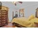 Cozy bedroom featuring hardwood floors, soft lighting, and a ceiling fan at 1792 Hoffman Rd, Gastonia, NC 28054