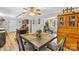 Cozy dining room featuring a wooden table set for four, adjacent to a kitchen with stainless steel appliances at 1792 Hoffman Rd, Gastonia, NC 28054
