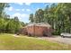 Brick home featuring a well manicured lawn, back patio, and convenient parking at 1792 Hoffman Rd, Gastonia, NC 28054