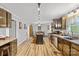 Spacious kitchen with wood cabinetry, stainless steel appliances, and an island, leading to a dining area at 1792 Hoffman Rd, Gastonia, NC 28054