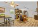 Open-concept kitchen and dining area features wood cabinets, stainless steel appliances, and a breakfast bar at 1792 Hoffman Rd, Gastonia, NC 28054
