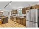 Bright kitchen showcasing stainless appliances, wood cabinets, and a view of the dining area at 1792 Hoffman Rd, Gastonia, NC 28054