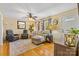 Inviting living room with hardwood floors, neutral tones, and comfortable seating, creating a cozy atmosphere at 1792 Hoffman Rd, Gastonia, NC 28054