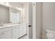 Spacious bathroom featuring double sinks, a large mirror, and modern lighting fixtures at 2013 Clarksdale Dr # 38, Charlotte, NC 28206