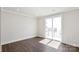 This spacious bedroom features a sliding door that provides access to a private balcony at 2013 Clarksdale Dr # 38, Charlotte, NC 28206