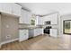 Well-equipped kitchen with stainless steel appliances, white cabinets, and modern finishes at 213 Benfield Rd, Kings Mountain, NC 28086