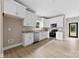 New kitchen with granite countertops, stainless steel appliances, white cabinets, and wood-look floors at 213 Benfield Rd, Kings Mountain, NC 28086