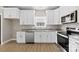 Bright kitchen with stainless steel appliances, granite countertops, and stylish cabinetry at 213 Benfield Rd, Kings Mountain, NC 28086