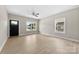 Bright, open living room featuring light wood floors, large windows, and neutral wall paint at 213 Benfield Rd, Kings Mountain, NC 28086