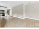 Spacious living area showcasing light floors, recessed lighting, and a smooth transition to the kitchen space at 213 Benfield Rd, Kings Mountain, NC 28086