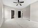 Spacious carpeted main bedroom with a ceiling fan, natural light, and a view of the ensuite bathroom at 213 Benfield Rd, Kings Mountain, NC 28086