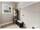 A well-lit utility room features shelving, a window, and essential appliances at 213 Benfield Rd, Kings Mountain, NC 28086