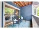 Cozy balcony area with outdoor seating, stylish rug, and sliding glass doors for indoor-outdoor living at 2209 Sumner Green Ave # M, Charlotte, NC 28203