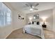 Cozy bedroom featuring neutral tones, carpet, and updated ceiling fan with attached lighting at 2209 Sumner Green Ave # M, Charlotte, NC 28203