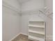 Walk-in closet with shelving and plenty of storage space in a light-colored room at 2209 Sumner Green Ave # M, Charlotte, NC 28203