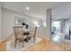 Charming dining area with a modern table set and an open view to the living room at 2209 Sumner Green Ave # M, Charlotte, NC 28203