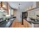 Functional kitchen with stainless steel appliances and granite countertops at 2209 Sumner Green Ave # M, Charlotte, NC 28203