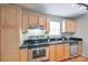 Practical kitchen featuring stainless steel appliances and ample cabinet space at 2209 Sumner Green Ave # M, Charlotte, NC 28203