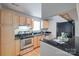 Well-equipped kitchen with stainless steel appliances and granite countertops at 2209 Sumner Green Ave # M, Charlotte, NC 28203