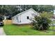 View of the back of the home showcasing the yard, fence, and a colorful flower bush at 2328 Milton Ave, Gastonia, NC 28052