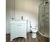 Bright bathroom with white vanity, toilet, and glass-enclosed shower, creating a clean and modern aesthetic at 2328 Milton Ave, Gastonia, NC 28052