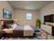 Tastefully furnished bedroom featuring a large bed, sleek furniture, and modern decor at 2328 Milton Ave, Gastonia, NC 28052
